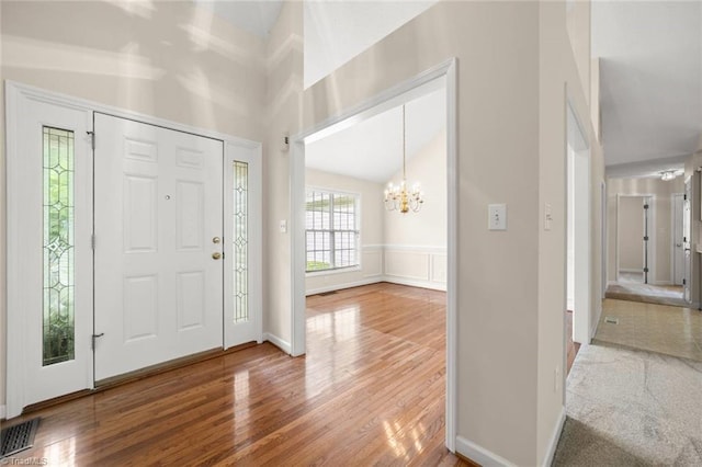 145 Millers Crossing Ct, Winston-Salem, NC 27103 - entrance foyer featuring a chandelier, wood finished floors, and a high ceiling