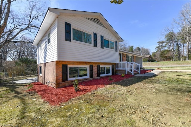 split level home with brick siding