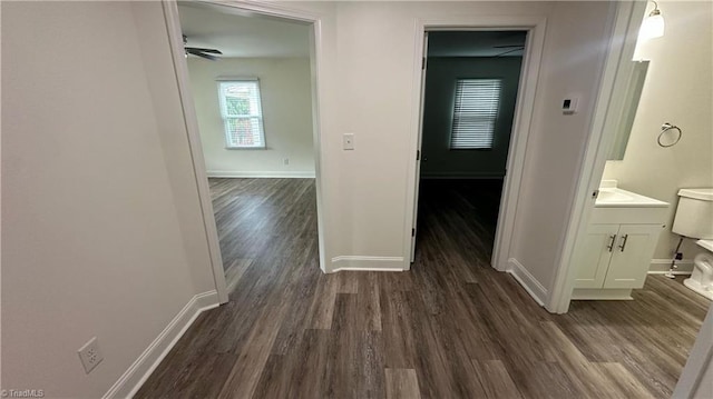 1004 Tabor St, High Point, NC 27262 - hallway featuring dark wood-style flooring and baseboards