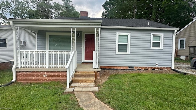 1004 Tabor St, High Point, NC 27262 - bungalow with covered porch, a front lawn, a chimney, and crawl space
