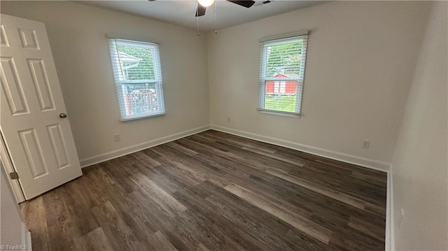 1004 Tabor St, High Point, NC 27262 - empty room featuring healthy amount of natural light, a ceiling fan, and dark wood finished floors