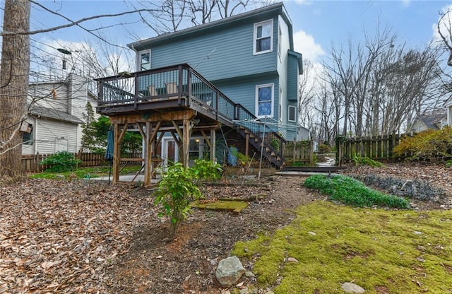 rear view of property featuring a deck