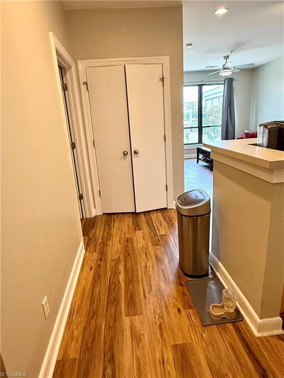 411 Washington St Unit 204, Greensboro, NC 27401 - hallway with wood finished floors, baseboards, and recessed lighting