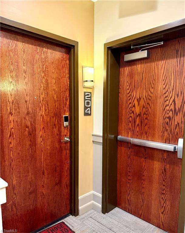 411 Washington St Unit 204, Greensboro, NC 27401 - property entrance featuring elevator