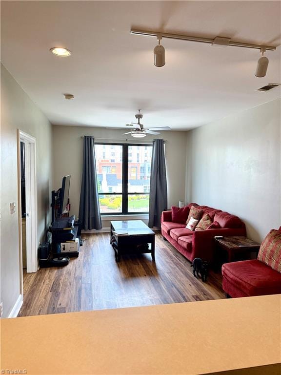 411 Washington St Unit 204, Greensboro, NC 27401 - living area with rail lighting, wood finished floors, recessed lighting, and a ceiling fan