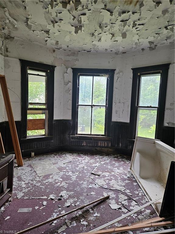 spare room with plenty of natural light