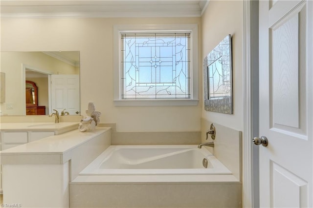 bathroom with ornamental molding, a bath, and vanity