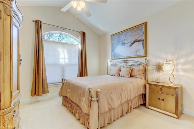 bedroom featuring ceiling fan, light carpet, and lofted ceiling