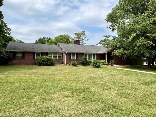 ranch-style house with a front yard