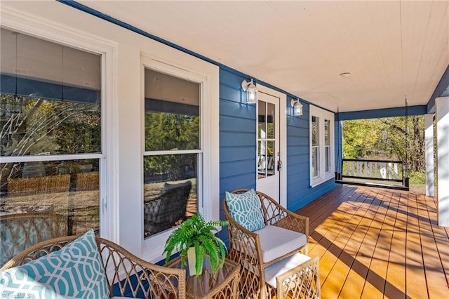 wooden deck featuring covered porch