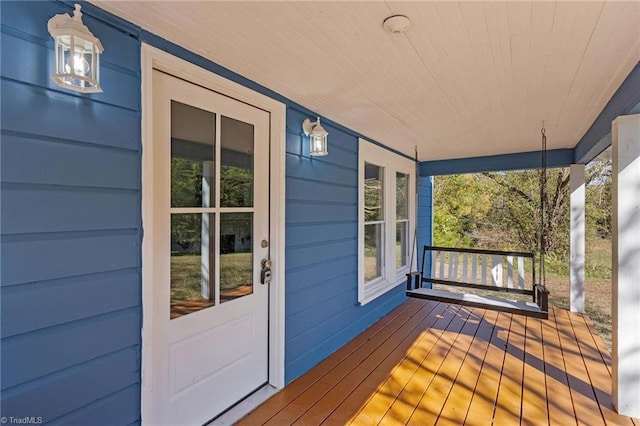 wooden terrace featuring a porch