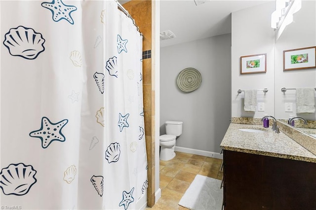 bathroom featuring vanity, toilet, and a shower with curtain