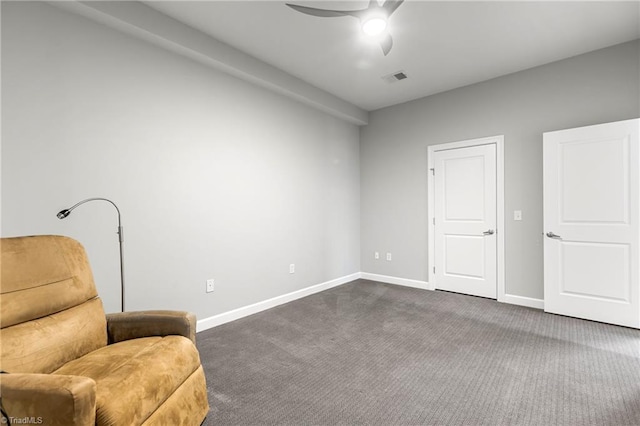 sitting room with ceiling fan and carpet floors