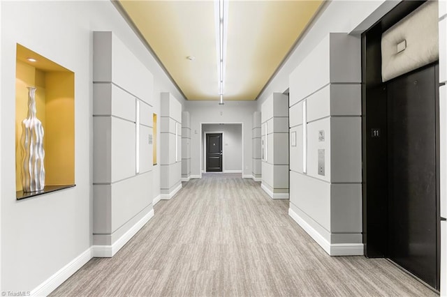 hallway featuring light hardwood / wood-style flooring