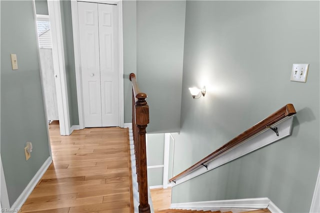 stairway featuring hardwood / wood-style flooring