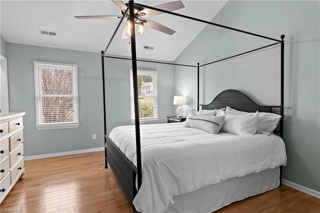 bedroom featuring vaulted ceiling, light hardwood / wood-style floors, and ceiling fan