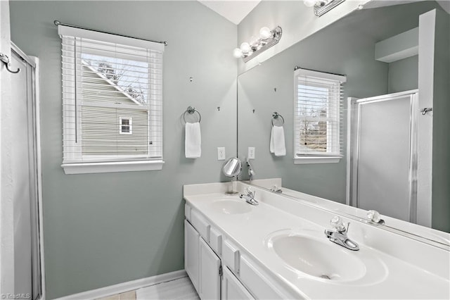 bathroom with vanity and a shower with shower door