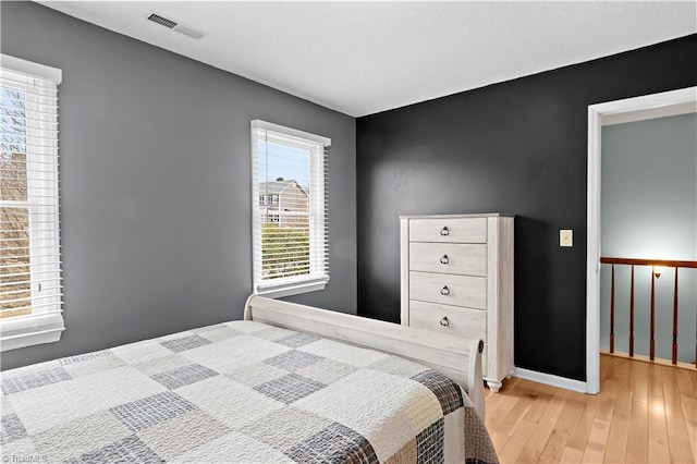 bedroom with light hardwood / wood-style floors