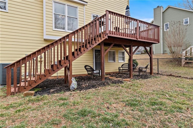 back of property featuring a yard and a deck