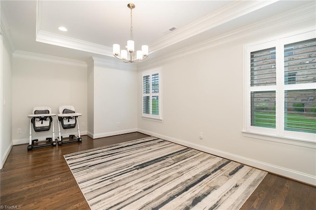6006 Tanoak Ct, Stokesdale, NC 27357 - unfurnished room with wood finished floors, a chandelier, baseboards, ornamental molding, and a tray ceiling