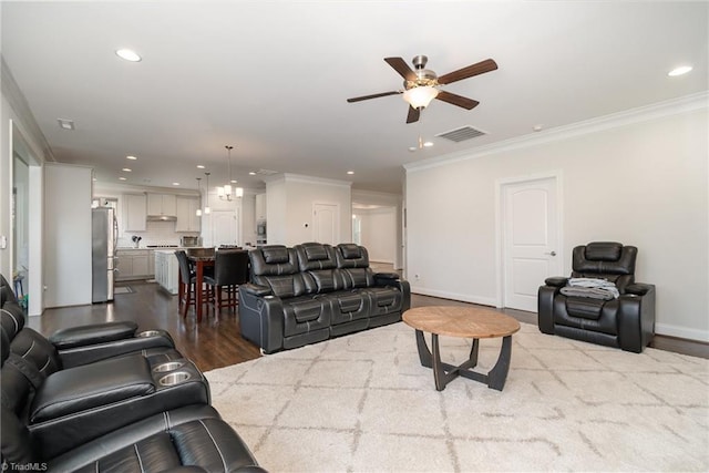 6006 Tanoak Ct, Stokesdale, NC 27357 - living room with a ceiling fan, recessed lighting, crown molding, baseboards, and wood finished floors