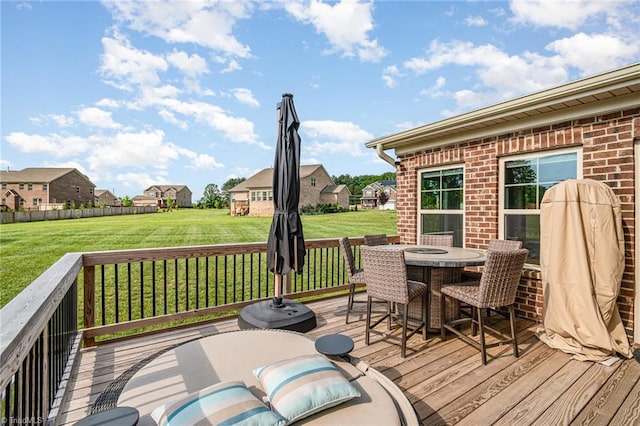6006 Tanoak Ct, Stokesdale, NC 27357 - wooden terrace with outdoor dining area, a yard, and a residential view