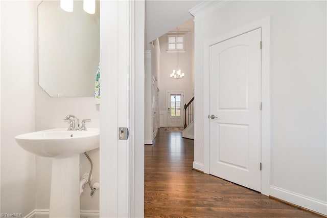6006 Tanoak Ct, Stokesdale, NC 27357 - bathroom with wood finished floors, baseboards, a chandelier, and a sink