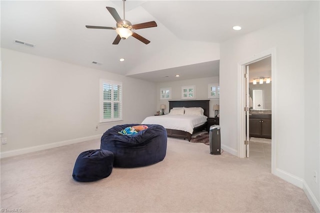 6006 Tanoak Ct, Stokesdale, NC 27357 - bedroom with light colored carpet, lofted ceiling, baseboards, connected bathroom, and a ceiling fan