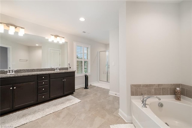 6006 Tanoak Ct, Stokesdale, NC 27357 - full bath featuring a garden tub, a shower stall, double vanity, baseboards, and recessed lighting