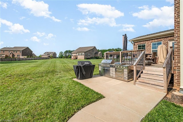 6006 Tanoak Ct, Stokesdale, NC 27357 - view of grassy yard with area for grilling, a deck, and a patio