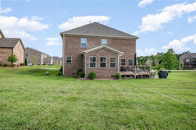 6006 Tanoak Ct, Stokesdale, NC 27357 - rear view of property with brick siding, a wooden deck, and a lawn
