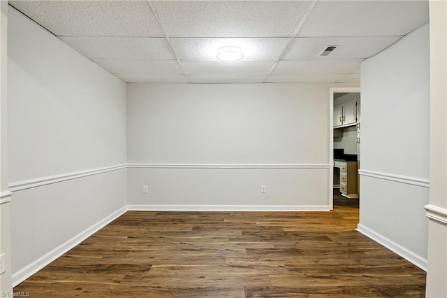 3985 Valley Ct Unit B, Winston-Salem, NC 27106 - spare room with a drop ceiling, dark wood-style floors, and baseboards