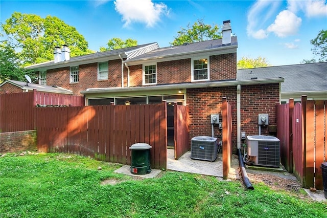 3985 Valley Ct Unit B, Winston-Salem, NC 27106 - back of property featuring a chimney, brick siding, and cooling unit