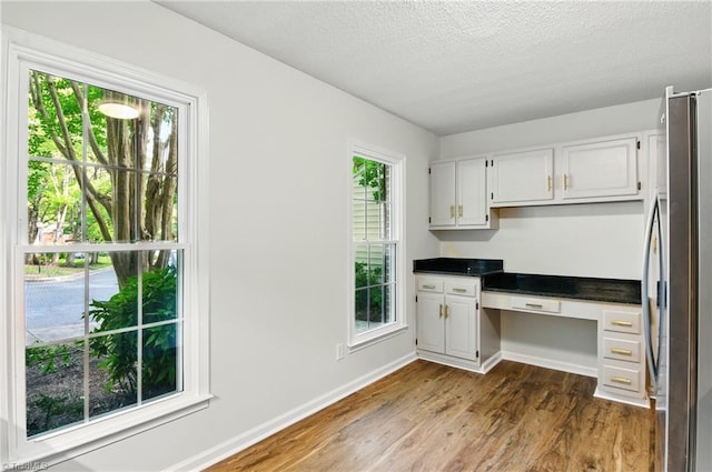 3985 Valley Ct Unit B, Winston-Salem, NC 27106 - unfurnished office with built in study area, dark wood-style floors, baseboards, and a textured ceiling