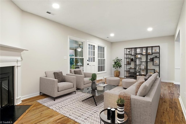 3985 Valley Ct Unit B, Winston-Salem, NC 27106 - living room with a fireplace with flush hearth, wood finished floors, baseboards, and recessed lighting