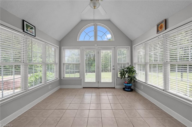 unfurnished sunroom featuring vaulted ceiling and french doors