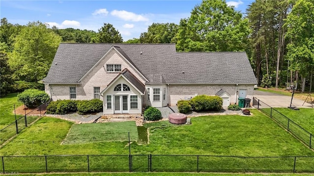 rear view of property featuring brick siding and roof with shingles