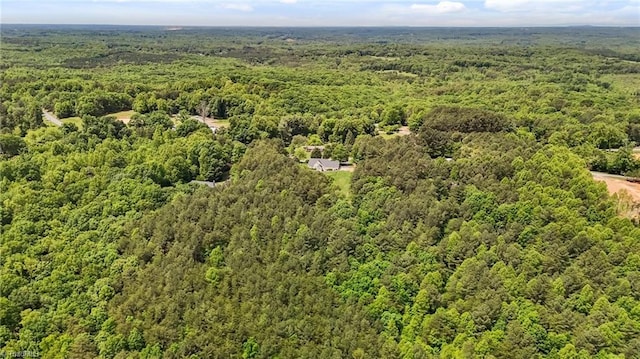 drone / aerial view of a heavily wooded area