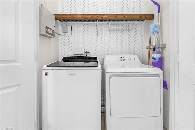 laundry room with electric panel, laundry area, and independent washer and dryer