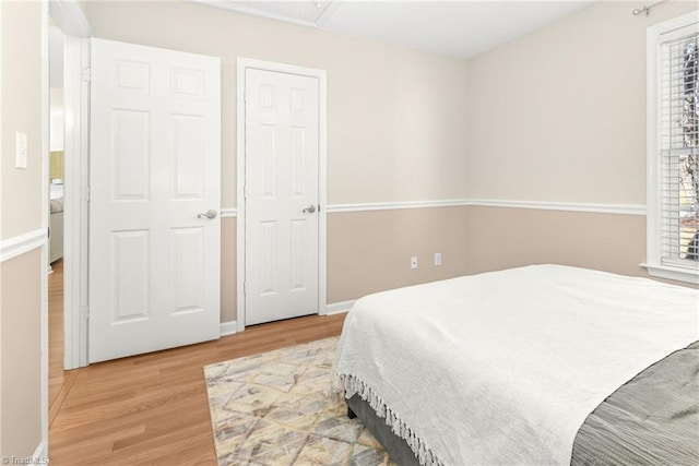 bedroom with wood finished floors