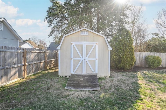 view of shed with a fenced backyard