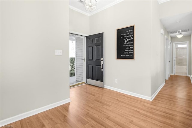 entrance foyer with plenty of natural light, light wood-style flooring, visible vents, and baseboards