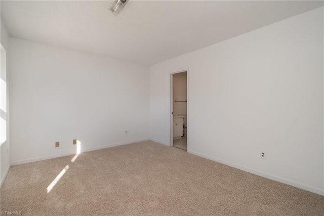 empty room featuring light colored carpet