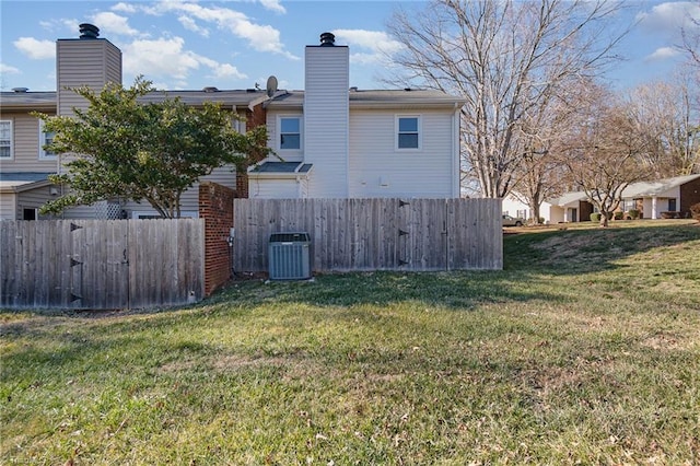 exterior space featuring a yard and central air condition unit