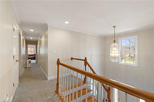 hall featuring crown molding, baseboards, an upstairs landing, light carpet, and recessed lighting