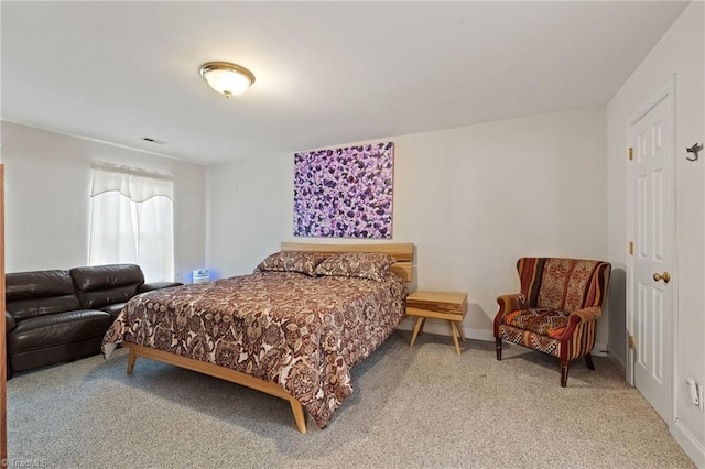 bedroom with carpet flooring, baseboards, and visible vents