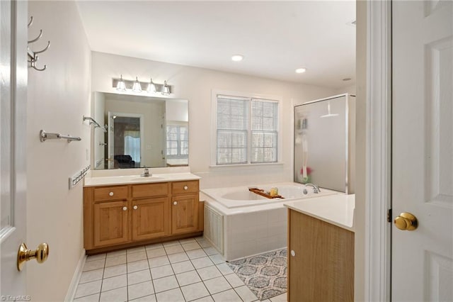 full bathroom with tile patterned floors, recessed lighting, a shower stall, a bath, and vanity