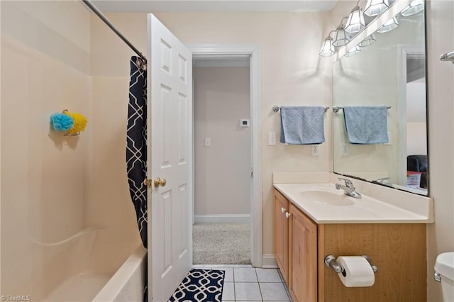 bathroom featuring tile patterned floors, shower / bath combo with shower curtain, toilet, baseboards, and vanity