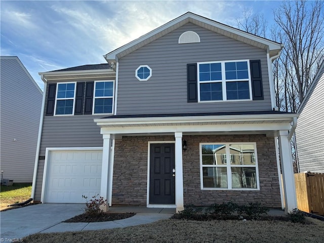 view of front property featuring a garage and covered porch