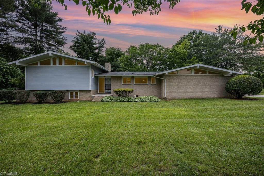 985 Needmore Rd, Woodleaf, NC 27054 - view of front facade featuring a yard and a chimney